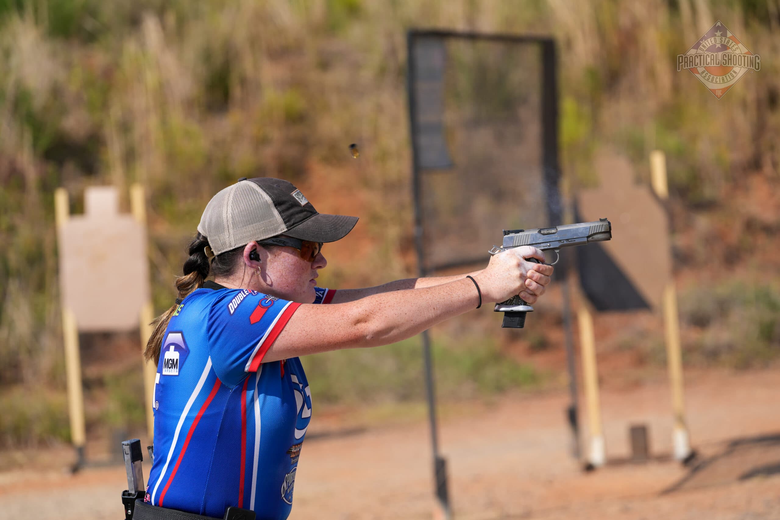 Beginner getting started with practical shooting sports at a USPSA match